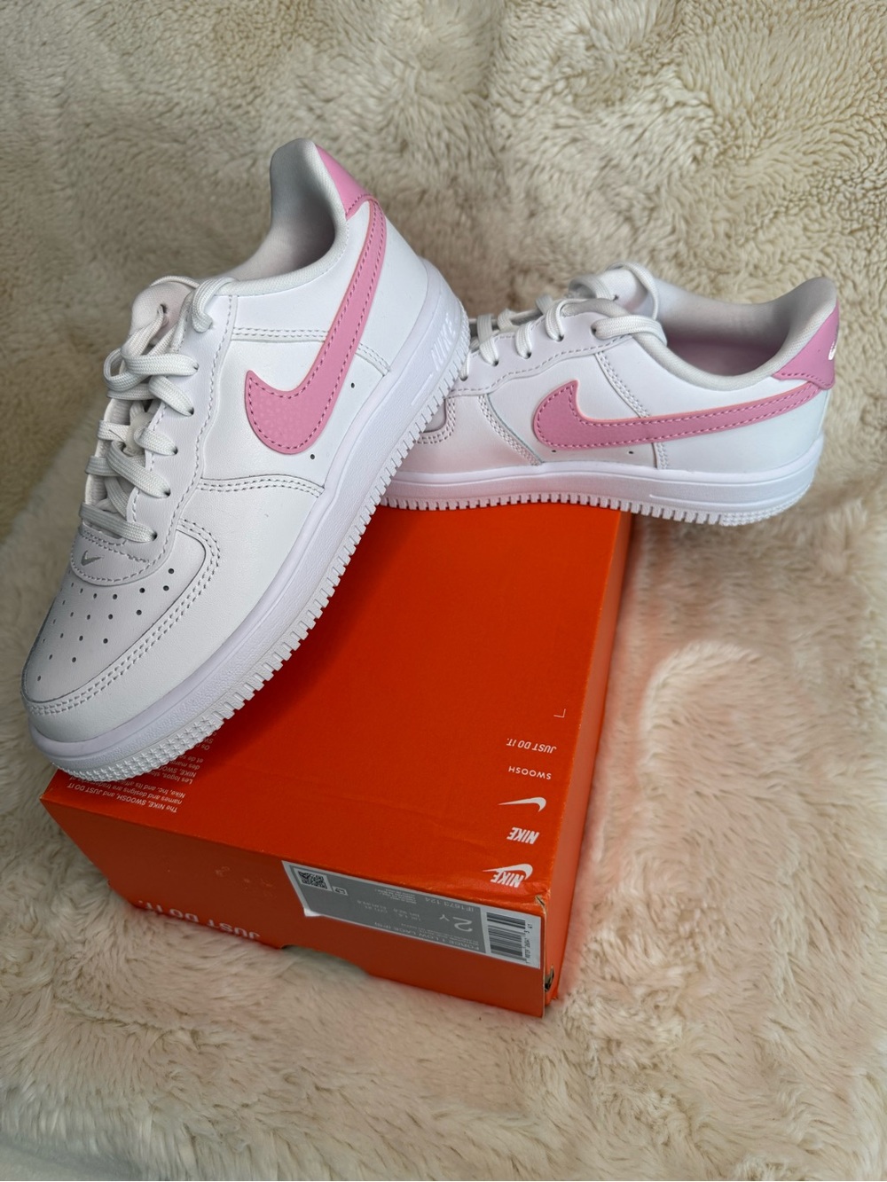 Nike White Low-Top Sneakers with Pink Swoosh
